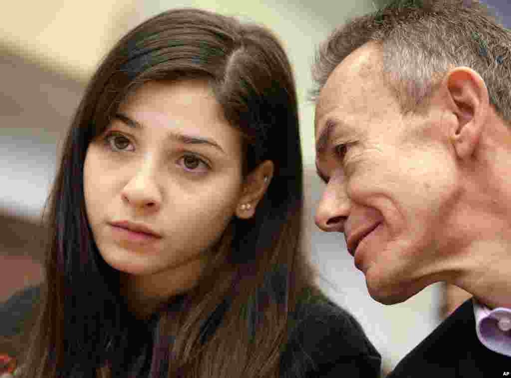 Pere Miro (R), Deputy Director General of Relations with the Olympic Movement, Director of Olympic Solidarity and NOC Relations, talks to Syrian swimmer Yusra Mardini (L) during a joint press conference of the International Olympic Committee (IOC) and the German Olympic Sports Confederation (DOSB) in Berlin, Germany.