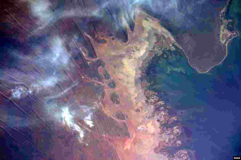 During an International Space Station flyover of Australia, NASA astronaut Jeff Williams captured a colorful image of the coast and shared it with his social media followers. "The unique terrain of the northwestern Australian coast," he wrote.