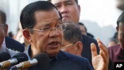 FILE: Cambodia's Prime Minister Hun Sen delivered a speech to passengers after they disembarked from the MS Westerdam, owned by Holland America Line, at the port of Sihanoukville, Cambodia, Friday, Feb. 14, 2020.