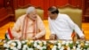 India's Prime Minister Narendra Modi (L) talks to Sri Lanka's President Maithripala Sirisena at the Presidential Secretariat in Colombo, March 13, 2015. 