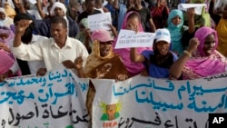 FILE - Mauritanian anti-slavery protesters march to demand the release of imprisoned abolitionist leader Biram Ould Abeid in Nouakchott, May 26, 2012. Slavery still exists in some parts of Mauritania despite a 2007 law banning the practice.