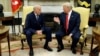 FILE - White House Chief of Staff John Kelly talks with President Donald Trump in the Oval Office of the White House, in Washington, July 31, 2017. 
