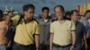 Philippine President Benigno Aquino (R) visits the navy port where some relief supplies arrive by boat in Tacloban, Nov. 17, 2013.