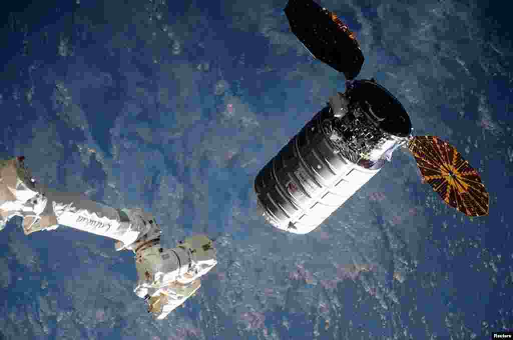 The Cygnus cargo ship nears the robotic arm at the International Space Station in this NASA image taken on March 26, 2016.&nbsp;The Cygnus capsule is loaded with nearly 7,500 pounds (3,400 kg) of food, science experiments and equipment including a 3-D printer to build tools for astronauts and non-stick grippers modeled after gecko feet.&nbsp;
