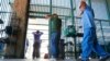 FILE - Suspected illegal immigrants are being processed at the Tucson Sector of the U.S. Customs and Border Protection headquarters in Tucson, Arizona, Aug. 9, 2012.