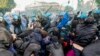 Italian police and demonstrators clash during a march in support of the Palestinian people in Rome, Oct. 5, 2024.