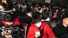 FILE: Passengers wearing masks are seen at the waiting area for a train to Wuhan at the Beijing West Railway Station, ahead of the Chinese Lunar New Year, in Beijing, China January 20, 2020. (REUTERS/Stringer)