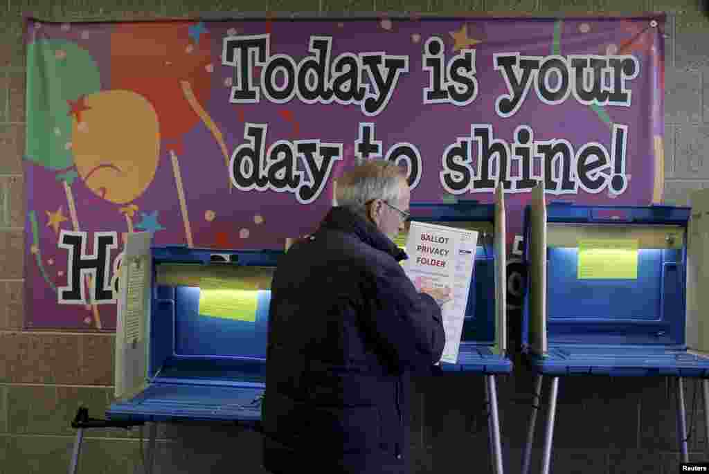 A voter casts his ballot in the Wisconsin presidential primary at a voting station in Milwaukee, Wisconsin, USA.