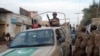 Security forces patrol at a suicide bomb blast site in Bannu