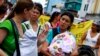 Women march with their children to demand longer maternity leave, San Jose, Costa Rica, Jan. 18, 2013.
