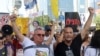 FILE - Families and supporters of Israeli hostages held by Hamas in Gaza since October 7 set out on a protest march from Tel Aviv toward Jerusalem in an attempt to pressure their government to negotiate a deal to release their loved ones, July 10, 2024.