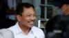 Mantan Menteri Kesehatan RI, Terawan Agus Putranto di bandara Halim Perdanakusuma, Jakarta, 15 Februari 2020. (REUTERS/Willy Kurniawan).
