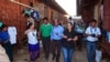 In this Feb.15, 2013 photo, U.N. human rights envoy for Myanmar Tomas Ojea Quintana, center, visits a refugee camp in Myitkyina, north Kachin state, Myanmar. The UN's human rights envoy to Myanmar Tomas Ojea Quintana concluded his six-day mission to Myan