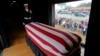  The flag-draped casket of former President George H.W. Bush passes through Magnolia, Texas, Dec. 6, 2018, along the route from Spring to College Station, Texas.