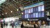People walk through the Sydney Central railway station in the city centre following the easing of restrictions implemented to curb the spread of the coronavirus disease (COVID-19) in Sydney, Australia, June 16, 2020. 