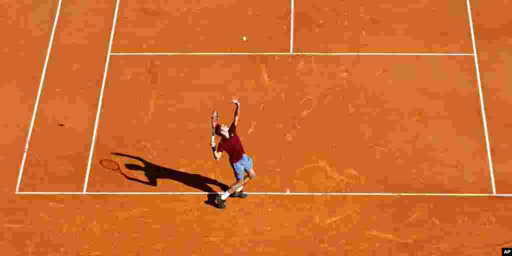 Swiss player Roger Federer serves to Guillermo Garcia Lopez of Spain during their match at the Monte Carlo Tennis Masters tournament in Monaco.