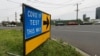 A sign leading to a COVID-19 testing station in Melbourne, Australia, Thursday, Feb. 4, 2021. All competition at six Australian Open tuneup events scheduled for Thursday was called off after a worker at one of the tournaments' Melbourne quarantine…