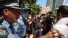 FILE - Police clash with protesters on Australia Day demanding that the country's national day be changed, as the date marks the arrival of Britain's first fleet and subsequent colonization of indigenous Australians, at a march in Sydney, Jan. 26, 2021.