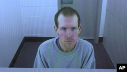 FILE - In this March 26, 2020, image made from video, Brenton Harrison Tarrant appears in a screen via video link in Christchurch, New Zealand.