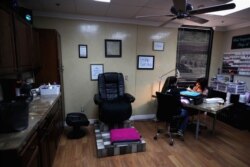 A woman has her nails polished at The Beauty Studios on April 3, 2020, in Glendale, Arizona. Arizona Gov. Doug Ducey expanded his statewide stay-at-home order to close hair and nail salons by Saturday.