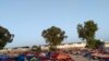 After the detention center was bombed, remaining structures appeared unstable and five days later, migrants were still sleeping outdoors. Pictured and transmitted to VOA July 7, 2019, in Tripoli, Libya. 