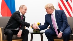 资料照片：美国总统特朗普2019年6月28日在日本大阪举行的二十国集团(G20)峰会上与俄罗斯总统普京举行双边会谈。