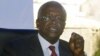 Uganda opposition presidential candidate Patrick Amama Mbabazi talks to reporters at his offices in capital, Kampala, Dec. 21, 2015.