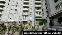 UKRAINE – In the center (from left to right): NSDC Secretary Oleksandr Turchinov, President of Ukraine Petro Poroshenko and Head of Donetsk Regional State Administration Oleksandr Kuts. The city of Avdiyivka, near the occupied Donetsk, May 6, 2019