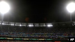 FILE - In this March 8, 2020, photo, fans nearly fill the Melbourne Cricket Ground during the Women's T20 World Cup cricket final match between Australia and India in Melbourne, Australia.