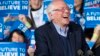 FILE - Democratic presidential candidate Sen. Bernie Sanders of Vermont laughs at a primary night rally in Essex Junction, Vermont, March 1, 2016.