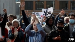 Members of the public celebrate outside the High Court after the conclusion of the sentencing hearing for Australian white supremacist Brenton Tarrant in Christchurch, New Zealand, on Aug. 27, 2020. 