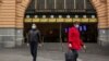 People are seen outside of Flinders Street Station amidst a lockdown in response to an outbreak of the coronavirus disease (COVID-19) in Melbourne, July 17, 2020.
