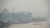 FILE - Haze from forest fires blankets villages along Kahayan river in Palangkaraya, Central Kalimantan, Indonesia, Sept. 20, 2019. Haze blown by monsoon winds from fires in Indonesia has begun affecting some areas of the Philippines.
