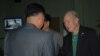 Former US Navy pilot and medal of honor recipient Thomas Hudner, seen here arriving at Pyongyang airport July 20, 2013, is greeted by North Korean officials. (VOA/S. Herman)