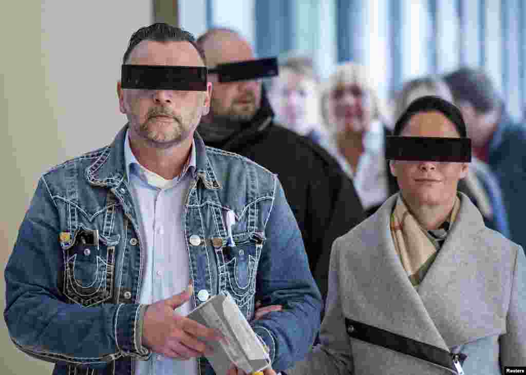 Lutz Bachmann (L), co-founder of Patriotic Europeans Against the Islamisation of the West (PEGIDA), arrives with his wife Vicky at a courtroom for his trial to be charged with incitement over Facebook posts in a court in Dresden, Germany.