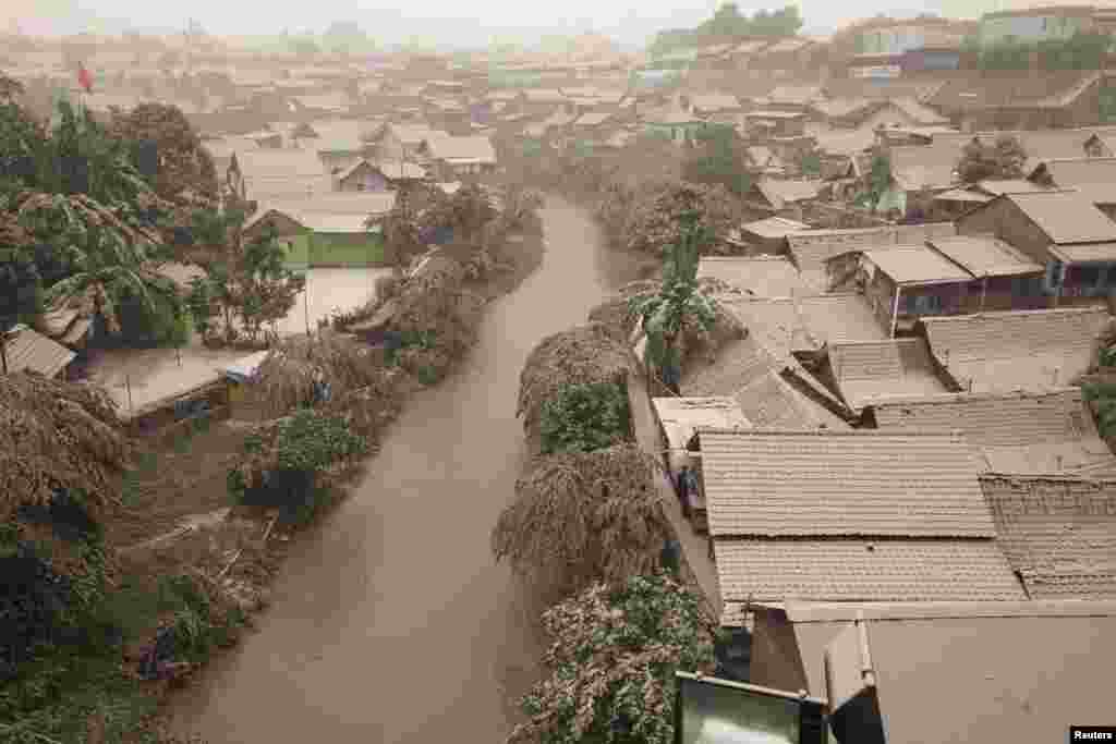 A housing complex is seen covered with ash from Mount Kelud, in Yogyakarta, Feb. 14, 2014.