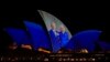 The Sydney Opera House sails show photos of Britain's King Charles and Queen Camilla soon after their arrival in Sydney, Oct. 18, 2024.