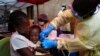 FILE - A child is vaccinated against Ebola in Beni, Democratic Republic of the Congo, July 13, 2019.
