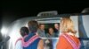 Handout photo of Apollo 11 crewmen and their wives.