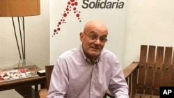 FILE - Feliciano Reyna, founder of the nonprofit Accion Solidaria, speaks during an interview in Caracas, Venezuela, April 27, 2017.