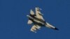 A Chinese People's Liberation Army (PLA) aircraft flies over the 68-nautical-mile scenic spot, one of mainland China's closest points to the island of Taiwan, in Pingtan island, Fujian province, China August 5, 2022. 