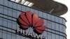 FILE PHOTO: The Huawei logo is pictured outside its Huawei's factory campus in Dongguan, Guangdong province, China, March 25, 2019.