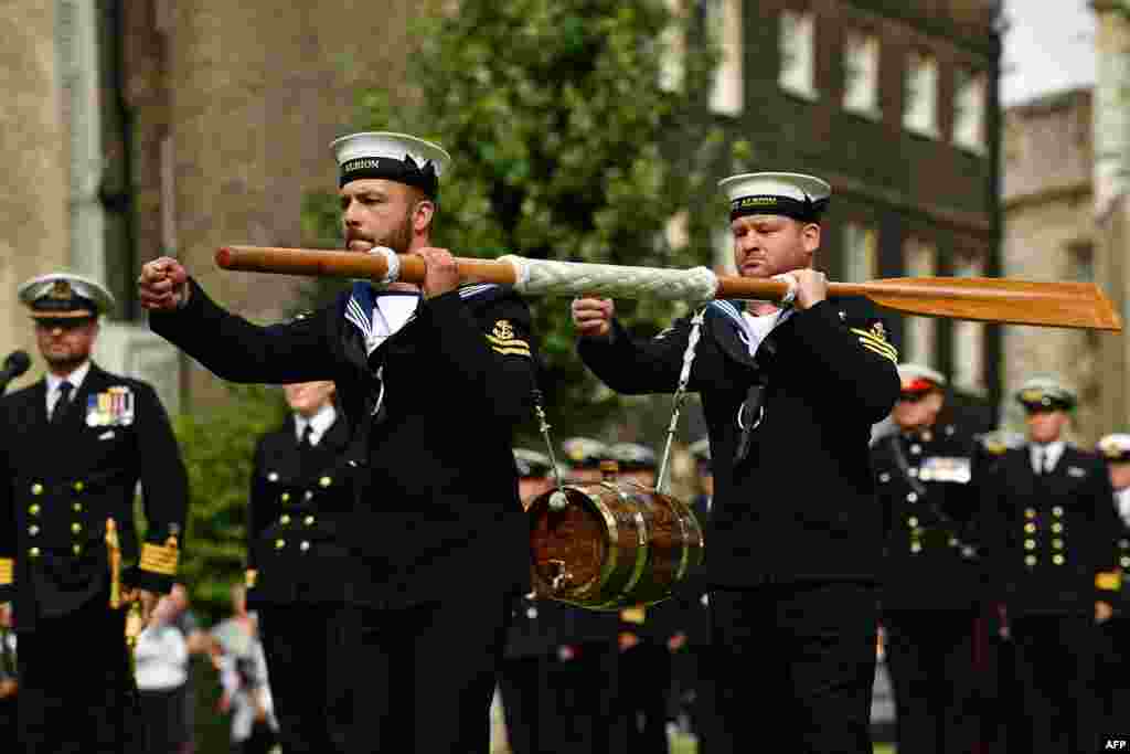 Crew of Britain&#39;s HMS Albion carry a keg of wine to the Tower of London during the Constable&#39;s Dues ceremony in London.&nbsp;The Constable&#39;s Dues ceremony dates back to the fourteenth century when ships travelling up stream to the city were required to moor at Tower Wharf to unload a portion of cargo for the constables as a form of toll.