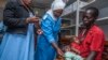 A health worker prepares to vaccinate a child against malaria, at Mitundu Community Hospital, in Malawi's capital of Lilongwe, April 23, 2019.