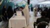 An Iranian votes at a polling station in the presidential election to choose a successor to Ebrahim Raisi following his death in a helicopter crash, in Tehran on June 28, 2024. (West Asia News Agency via Reuters)
