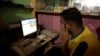 FIEL - A man explores social media on a computer at an internet club in Islamabad, Pakistan, August 11, 2016.