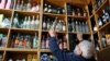 Mustafa Demirci arranges bottles of alcoholic beverages at his liquor shop ahead of a nationwide "full closure" amid the spread of the coronavirus, in Ankara, Turkey, April 28, 2021. 