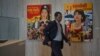 A man walked past movie posters at the 2019 Cambodia International Film Festival in Phnom Penh, Cambodia, March 12, 2019. (Khan Sokummono/VOA Khmer) 