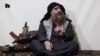 FILE - Abu Bakr al-Baghdadi, purportedly appears for the first time in five years in a propaganda video in an undisclosed location, in this undated TV grab taken from video released April 29 by Al-Furqan media.