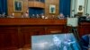 Chairman of the Joint Chiefs of Staff Gen. Mark Milley appears on a screen as he testifies before the House Armed Services Committee on the conclusion of military operations in Afghanistan on Capitol Hill in Washington, Sept. 29, 2021.